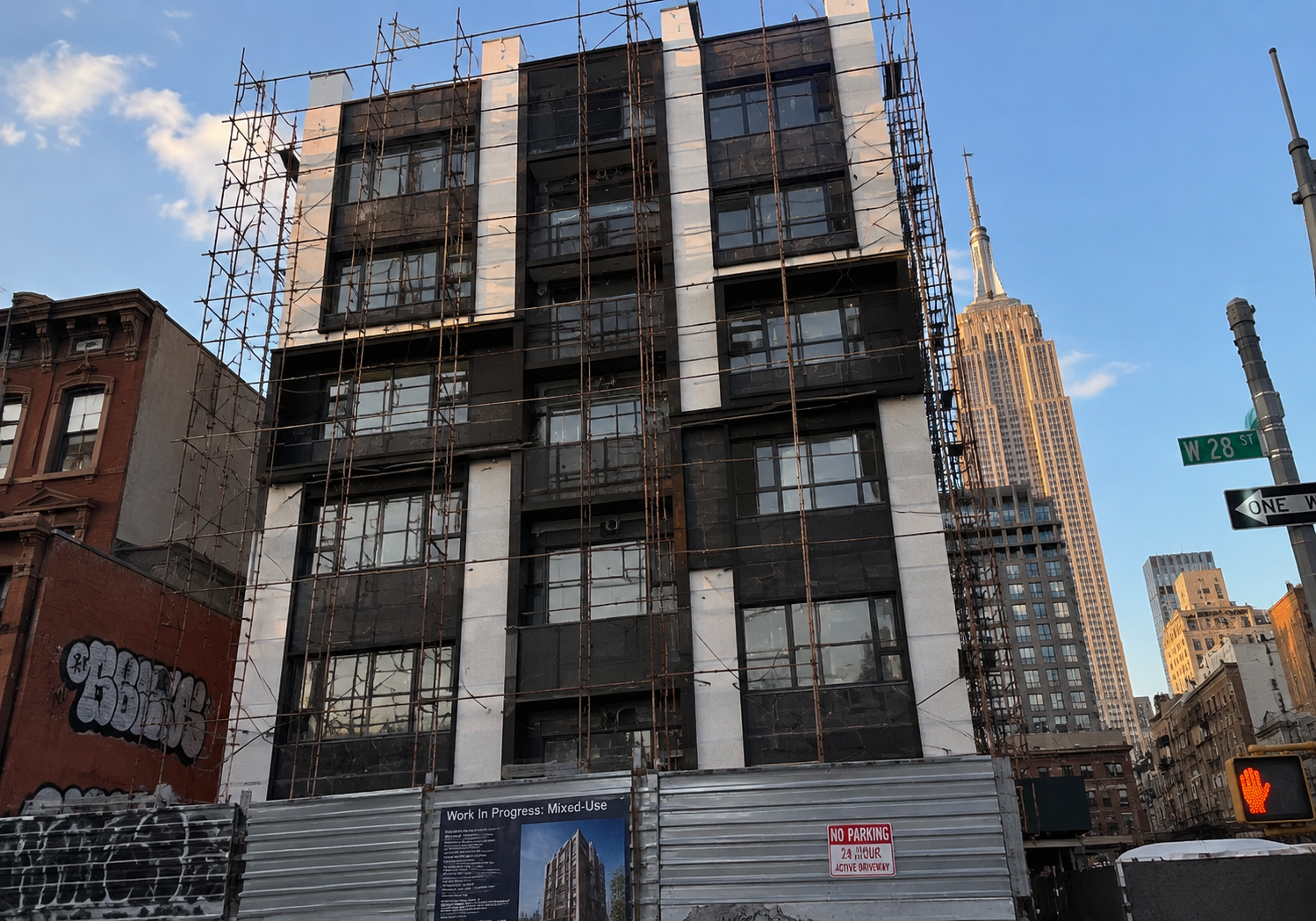 The same building under construction, frame and infill exposed